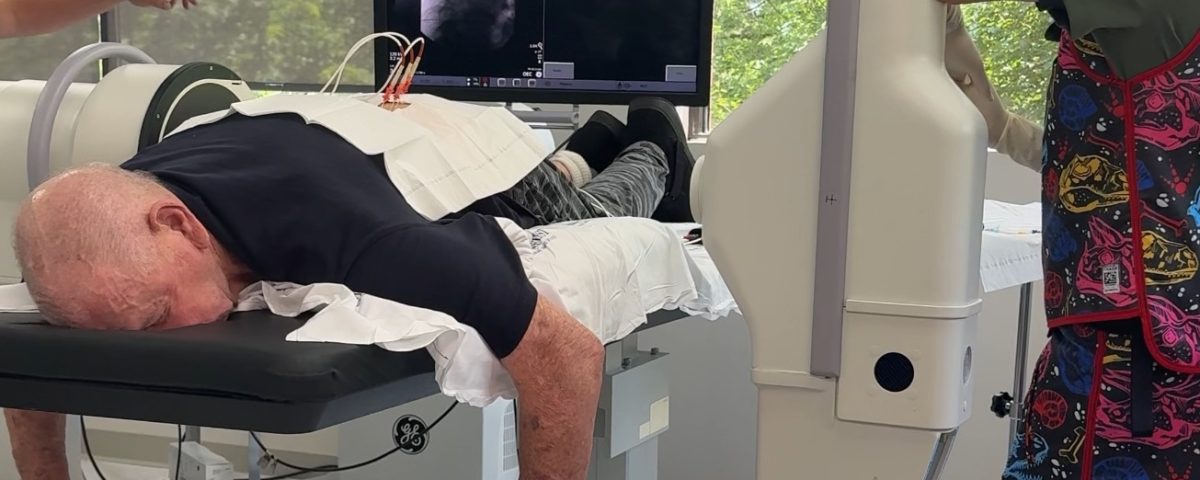 A doctor discussing pain management options with a patient after conservative treatments like yoga and physical therapy have failed.